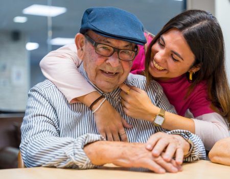 Tender nurse embracing a elder man in a geriatric Tender moment of a nurse embracing a elder man in a geriatric